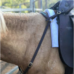 Leather_breastplate_attached_to_saddle_on_horse